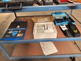a table with a lot of tools on top of it