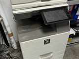 a printer that is sitting on top of a cabinet