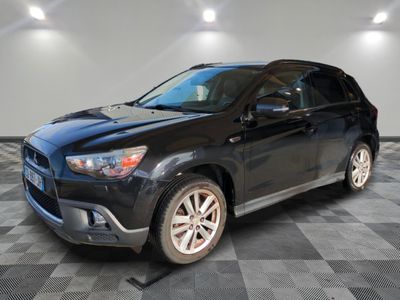 a picture of a black toyota rav parked in a garage