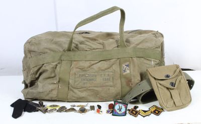 a duffel bag with a lot of items on the table