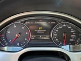 a close up of a car dashboard with various gauges