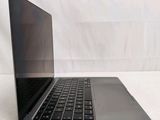 a laptop that is sitting on a white surface