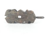 a small wooden elephant with a tag on it ' s back
