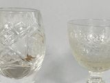 two wine glasses sitting next to each other on a table