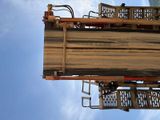 a large wooden structure with a ladder on top of it