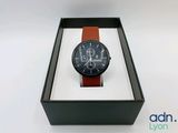an image of a watch in a box on a white surface