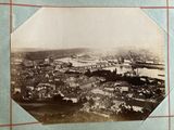 an old photo of a view of a city from the top of a building