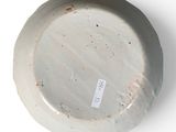 a white plate with a tag on it