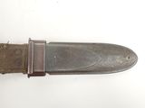 a knife that is laying on top of a table
