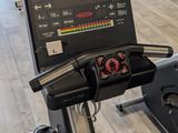 a tread machine in the middle of a gym room