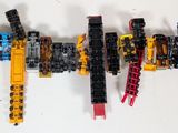 a lot of legos that are hanging on the wall