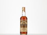 a bottle of old fashioned whiskey sitting on top of a table