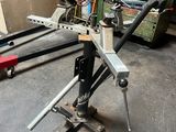 a picture of a man working on a machine in a garage