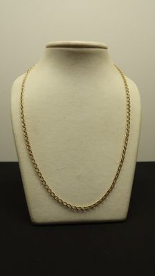 a close up of a mannequin with a chain on it