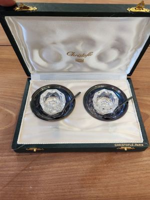 pair of silver and black glass cuff earrings in presentation case