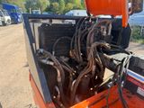 a truck that has a bunch of wires in the back of it