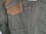 the back of a green jacket with a tag on it
