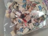 a bag full of stamps sitting on a table