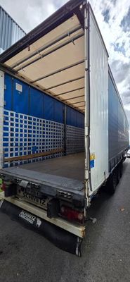 a truck that is parked on the side of the road