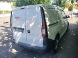 a white van that is parked on the side of the street