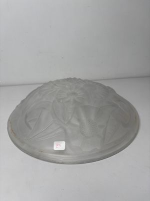 a glass bowl with a lid sitting on a table