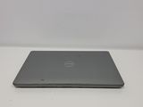 the back view of a dell laptop computer sitting on a white surface