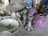 many vases that are sitting on a table