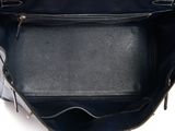 an image of a black purse on a white background