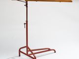 a wooden table with a metal base and a wooden top