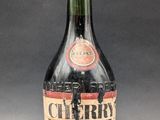 an old bottle of whiskey sitting on top of a table