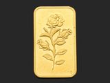une image représentant un lingot d'or orné d'une rose