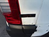 a white van with a sticker on the back of it