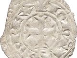 a close up of a coin on a white surface