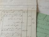 several old papers are sitting on a table next to a keyboard