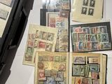 many different types of stamps on the table