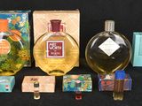 many different types of perfumes and boxes on the table