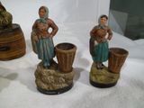 three figurines that are sitting on a table