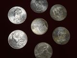 a close up of a bunch of coins sitting on top of a table