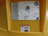 a ticket on the back of a yellow construction helmet