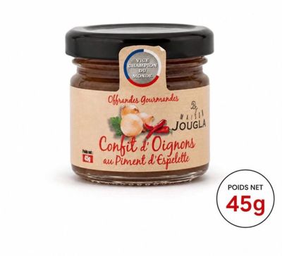the jar of confit d ' origines is on a white surface