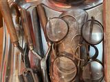 a lot of utensils and spoons on the table