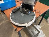 a table with a laptop and a printer on it