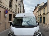 a white van that is parked on the side of the street