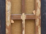 an old window with a wooden frame on the outside