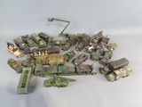 a lot of toy army vehicles that are on the table