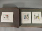 three framed pictures of a cat and a dog in a book