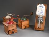 three different types of coffee grinders and a coffee grinder