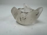 a glass bowl that has a bird on it