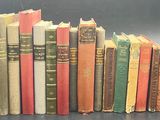 a lot of books that are stacked together on a table