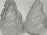 two frosted glass cones on a white surface